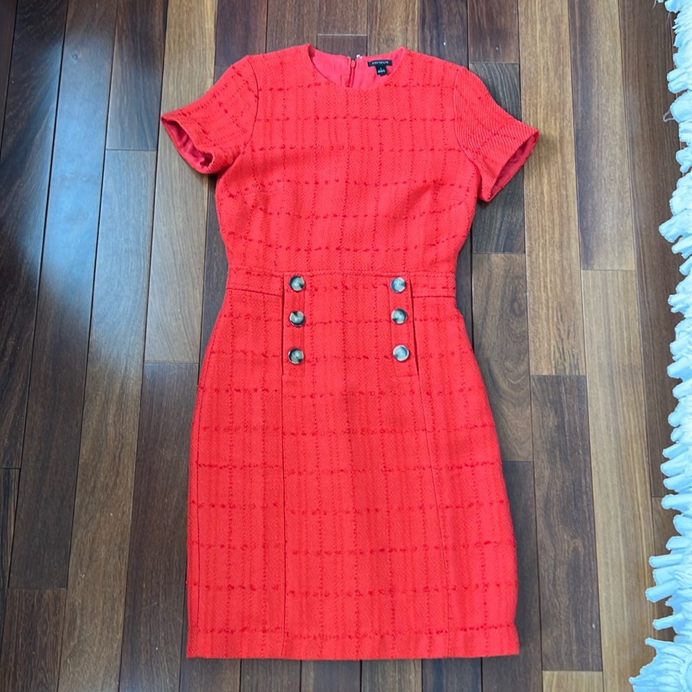 Knee length red dress.